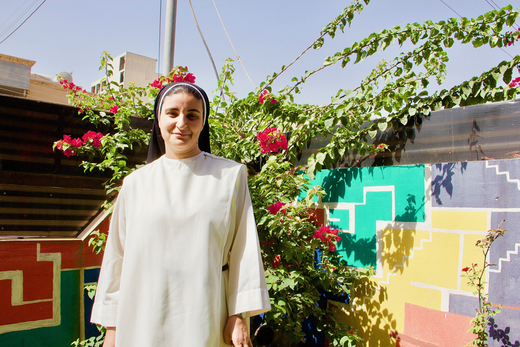 Sister Nazik Matty in her garden in Erbil